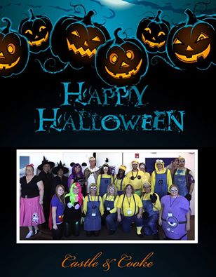 A halloween-themed poster with "happy halloween" text above a group photo of people in colorful minion and purple-themed costumes and masks, possibly at a workplace party.