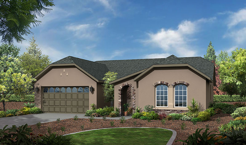 A single-story suburban home with a beige stucco exterior and a grey roof features a two-car garage, arched windows, and a landscaped front yard with a pathway surrounded by lush greenery.