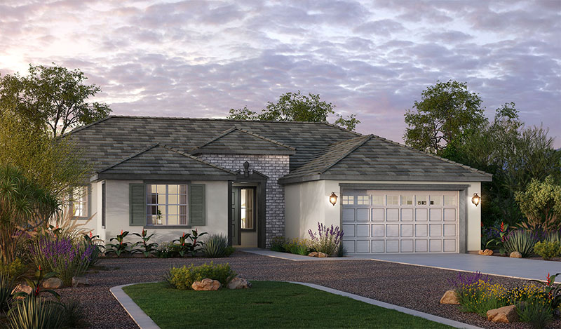 Single-story suburban house with a gray tile roof, stone accents around the front door, a two-car garage, and a landscaped yard with shrubs and flowers, under a partly cloudy sky at dusk.